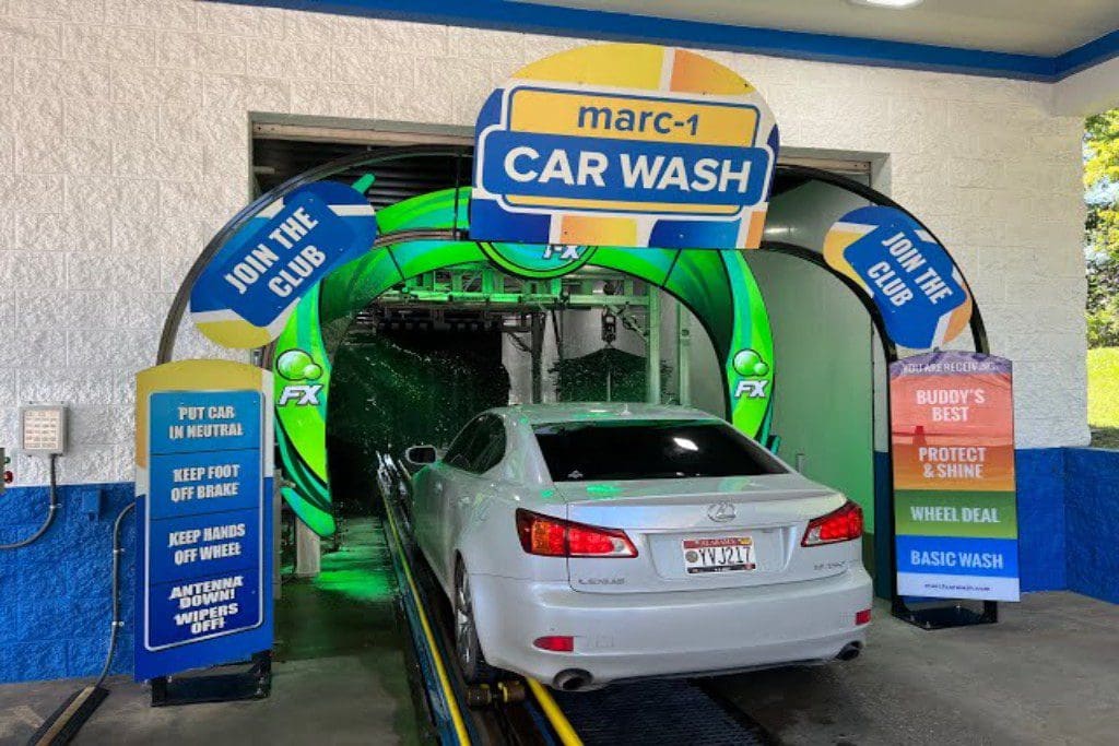 A car wash with a white car in it