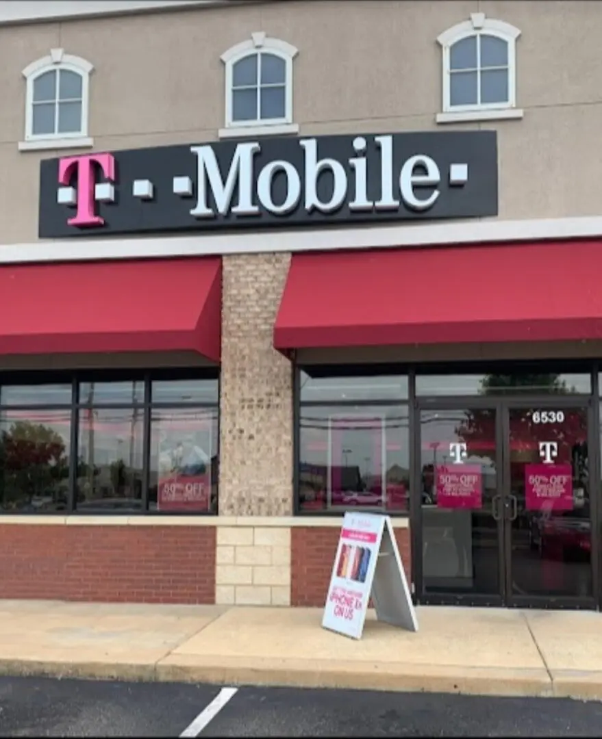 A t-mobile store with a sign in front of it.