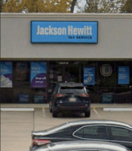 A car parked in front of a store.