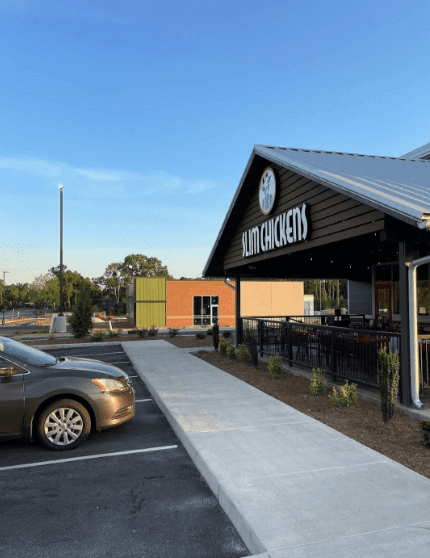 A car parked in front of a restaurant.