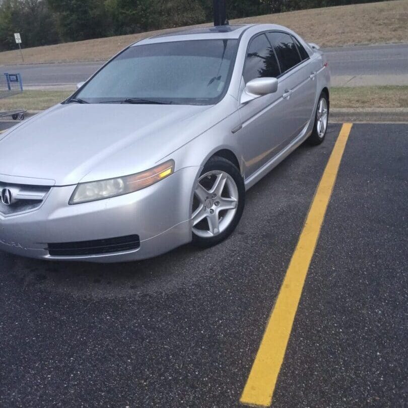 Silver sedan parked in a parking lot.